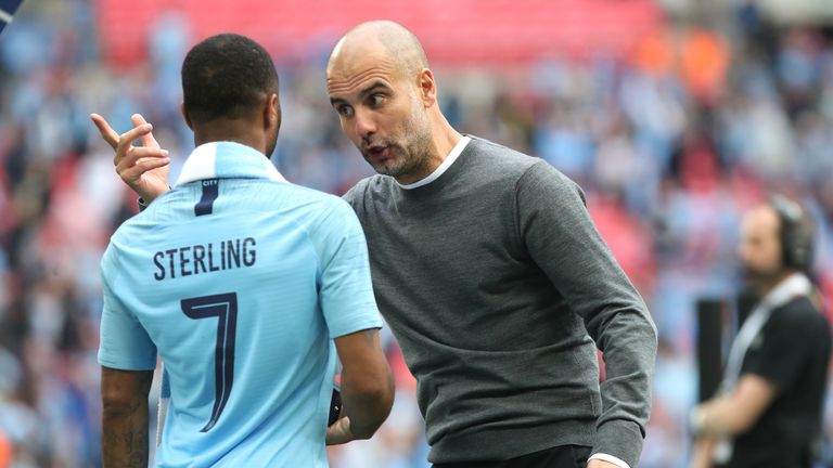 Manchester City's Raheem Sterling (left) and manager Pep Guardiola