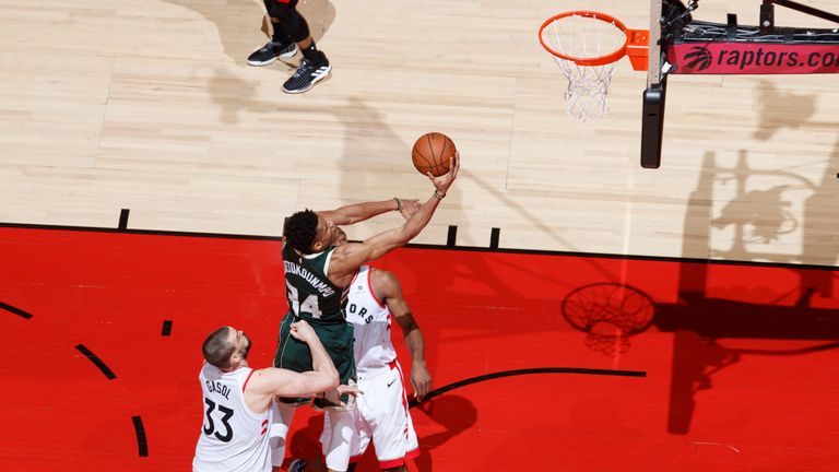 Giannis Antetokounmpo of the Milwaukee Bucks shoots the layup against the Toronto Raptors during Game Three of the Eastern Conference Finals