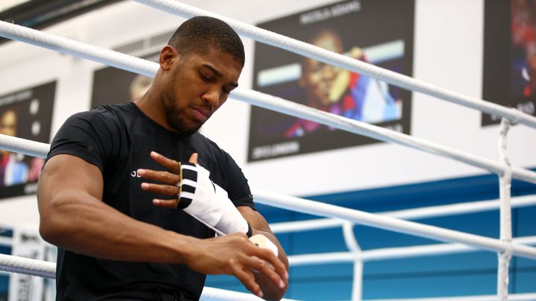 Anthony Joshua wraps his hands prior to a media session at the English institute of Sport in Sheffield