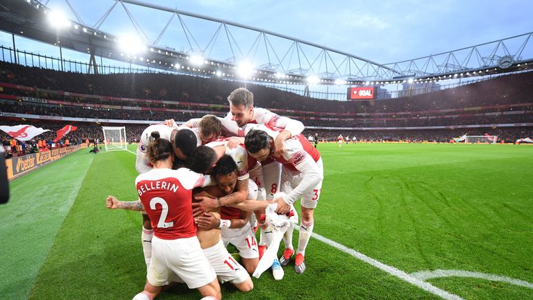 Arsenal players celebrate during their 4-2 win over Tottenham