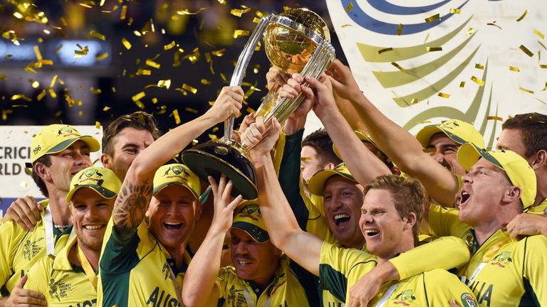 Australian cricketers celebrate with the trophy after the winning the 2015 Cricket World Cup final between Australia and New Zealand in Melbourne on March 29, 2015. 