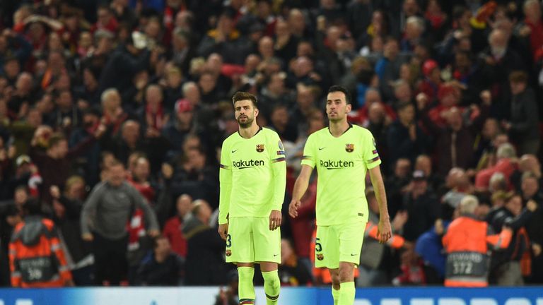 Gerard Pique and Sergio Busquets look dejected after the fourth goal