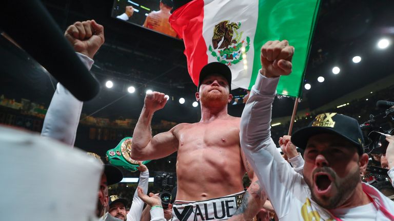 Saul 'Canelo' Alvarez celebrates after unifying the middleweight titles