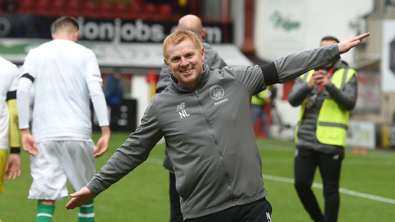 Celtic manager Neil Lennon celebrates his side's title win with his airplane celebration