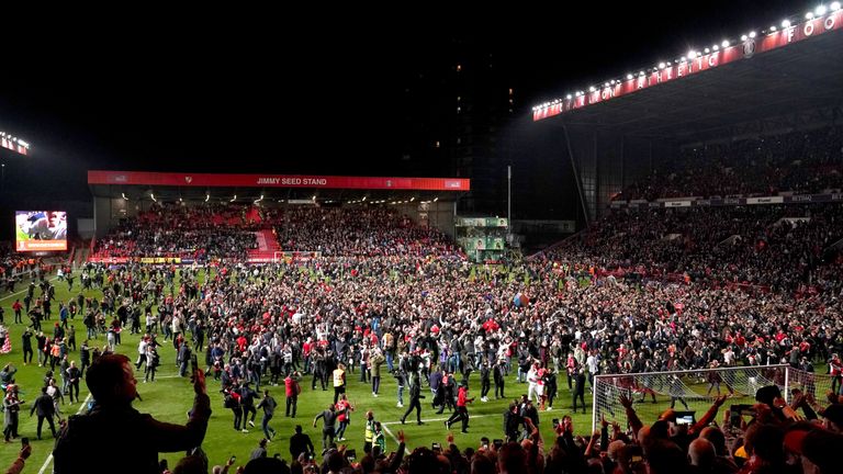 Fans run onto the pitch after Charlton Athletic win the Sky Bet League One Play-off, Second Leg match at The Valley, London.