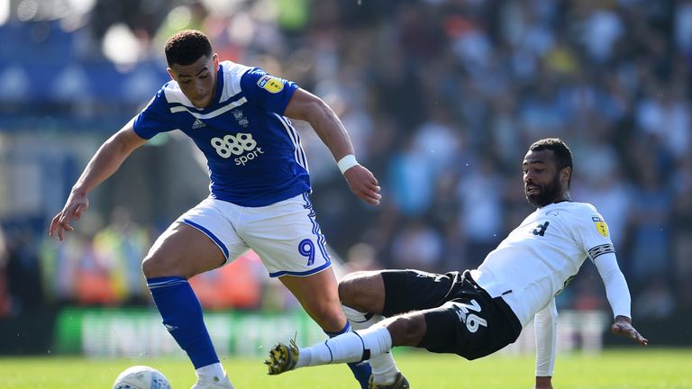 Che Adams of Birmingham is tackled by Ashley Cole of Derby