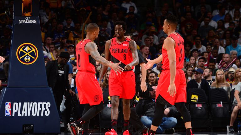 DENVER, CO - MAY 12: Damian Lillard high-fives Al-Farouq Aminu #8 and CJ McCollum #3 of the Portland Trail Blazers  against the Denver Nuggetsduring Game Seven of the Western Conference Semifinals of the 2019 NBA Playoffs on May 12, 2019 at the Pepsi Center in Denver, Colorado. NOTE TO USER: User expressly acknowledges and agrees that, by downloading and/or using this Photograph, user is consenting to the terms and conditions of the Getty Images License Agreement. Mandatory Copyright Notice: Copyright 2019 NBAE (Photo by Bart Young/NBAE via Getty Images)