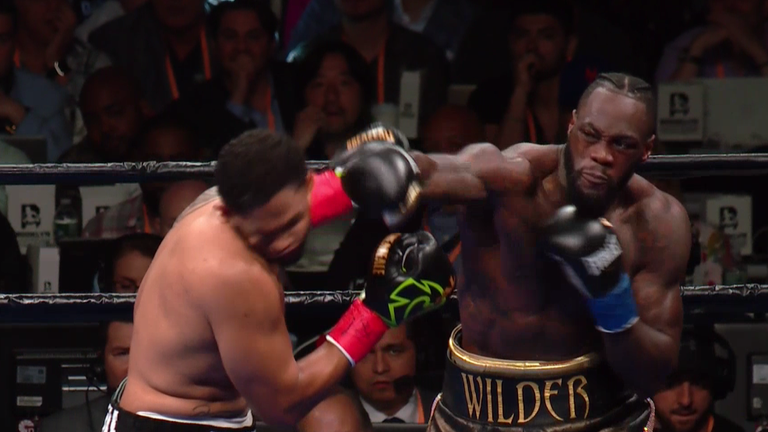 Deontay Wilder lands a huge right hand to end Dominic Breazeale's title challenge