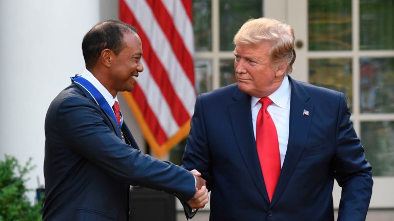 US President Donald Trump and US golfer Tiger Woods shake hands after Trump awarded him with the Presidential Medal of Freedom during a ceremony in the Rose Garden of the White House in Washington, DC, on May 6, 2019