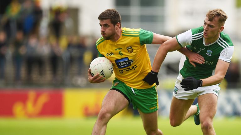 Daire Ó Baoill of Donegal in action against Ultan Kelm of Fermanagh