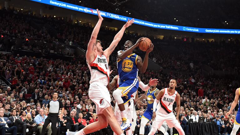 Draymond Green #23 of the Golden State Warriors drives to the basket against Meyers Leonard #11 of the Portland Trail Blazers in game three of the NBA Western Conference Finals at Moda Center on May 18, 2019 in Portland, Oregon. 