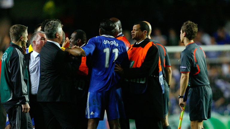Stewards intervene as Drogba looked to confront the referee over his controversial performance