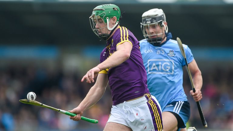 Aidan Nolan of Wexford in action against Cian Boland of Dublin