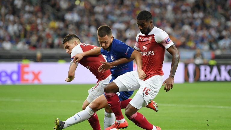 Eden Hazard is squeezed out by Ainsley Maitland-Niles (right) and Lucas Torreira