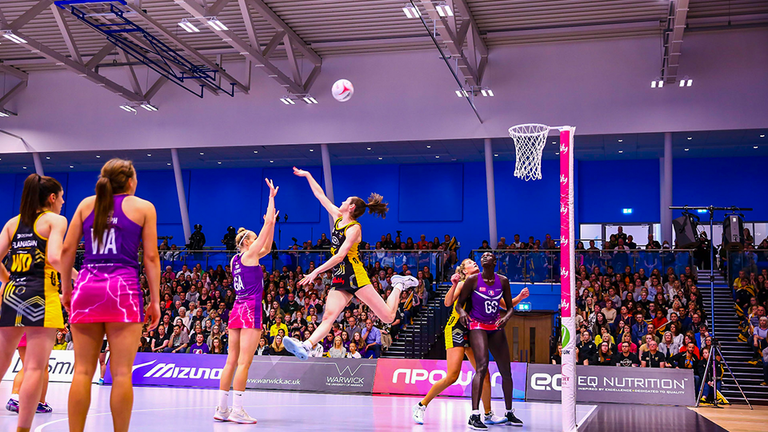 Lightning's Ella Clark putting up a shot despite the pressure of Wasps' Hannah Knights during the 2019 Vitality Netball Superleague semi-final (Credit: Ben Lumley)