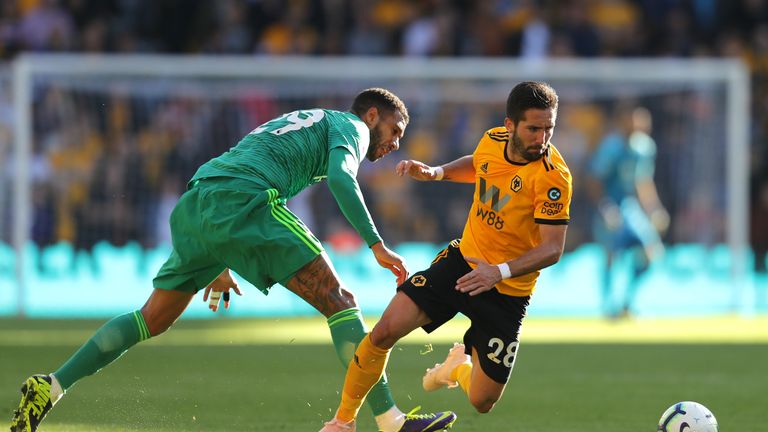 Etienne Capoue and Joao Moutinho during the Premier League match between Wolverhampton Wanderers and Watford FC at Molineux on October 20, 2018 in Wolverhampton, United Kingdom.