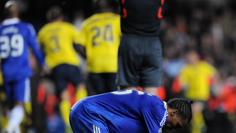 Chelsea winger Florent Malouda falls to his knees at the full-time whistle