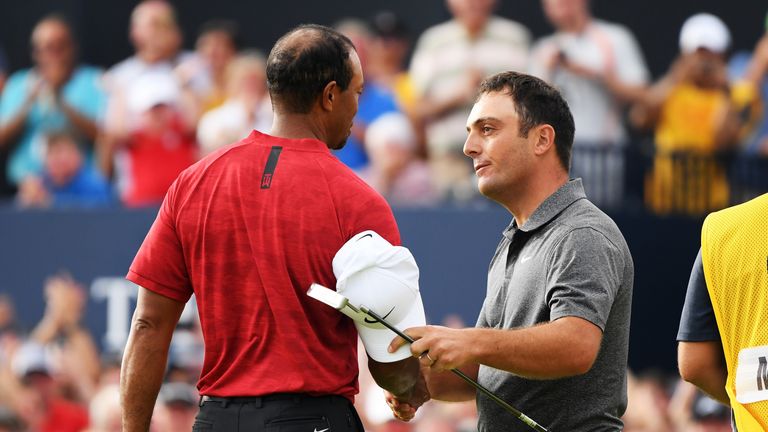 Francesco Molinari of Italy (R) is congratulated by Tiger Woods of the United States after a birdie on the 18th hole during the final round of the 147th Open Championship at Carnoustie Golf Club on July 22, 2018 in Carnoustie, Scotland.
