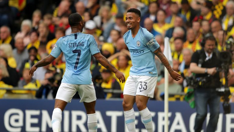 Gabriel Jesus and Raheem Sterling celebrate Manchester City's second against Watford