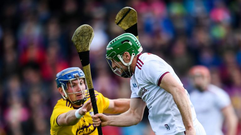 David Burke of Galway in action against Kevin Foley of Wexford