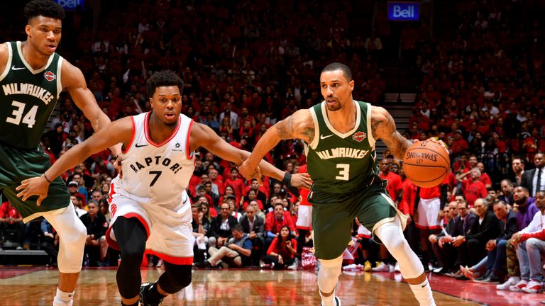  George Hill #3 of the Milwaukee Bucks handles the ball against Kyle Lowry #7 of the Toronto Raptors during Game Three of the Eastern Conference Finals of the 2019 NBA Playoffs on May 19, 2019 at the Scotiabank Arena in Toronto, Ontario, Canada.