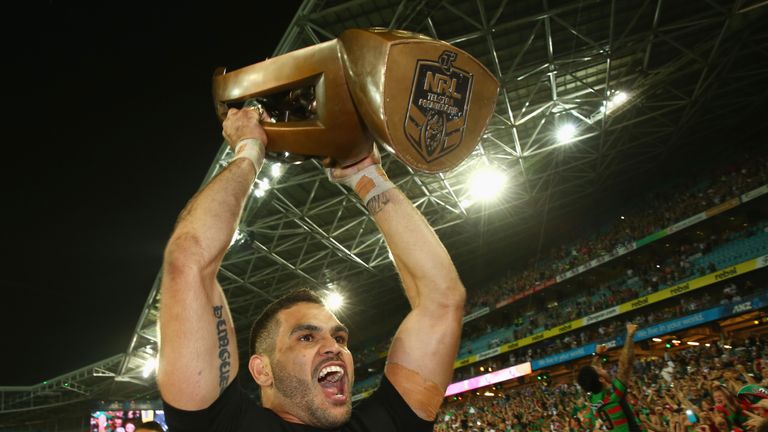 Greg Inglis of the Rabbitohs holds the trophy up to the crowd as he celebrates victory during the 2014 NRL Grand Final match between the South Sydney Rabbitohs and the Canterbury Bulldogs at ANZ Stadium on October 5, 2014 in Sydney, Australia. 