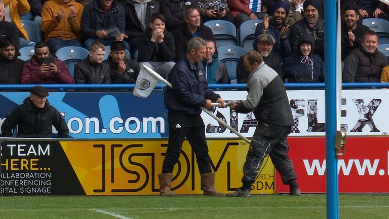 huddersfield ground staff struggle with corner flag after isaac mbenza breaks it celebrating goal