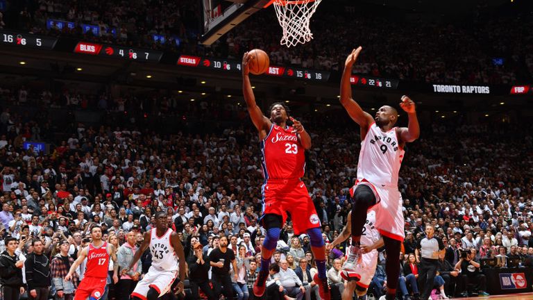 Jimmy Butler f the Philadelphia 76ers shoots a lay up to tie the game late in the fourth quarter against the Toronto Raptors during Game Seven of the Eastern Conference Semi-Finals of the 2019 NBA Playoffs