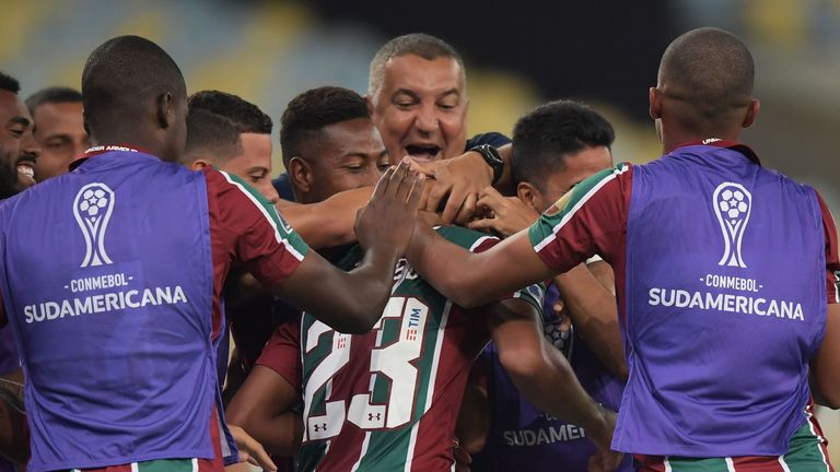 Joao Pedro is mobbed by his team-mates after scoring a hat-trick for Fluminense against Atletico Nacional