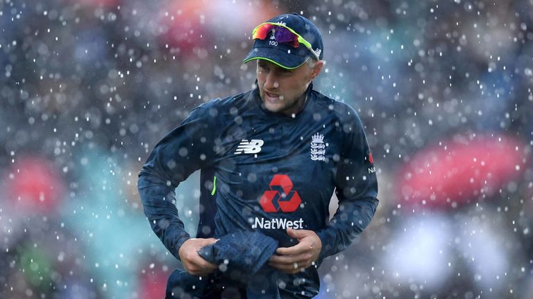 Joe Root leaves the field as rain stops play during the first ODI between England and Pakistan at the Kia Oval