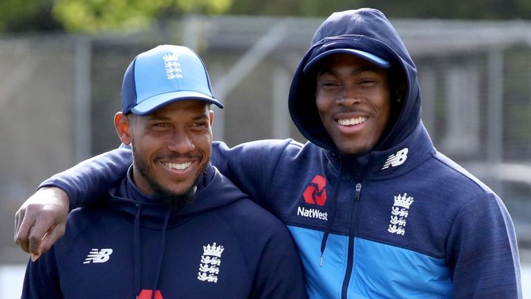 England's new player Jofra Archer (R) poses with Chris Jordan (C) and bowling coach Chris Silverwood before a one day international between Ireland and England Malahide cricket club, in Dublin on May 3, 2019. 