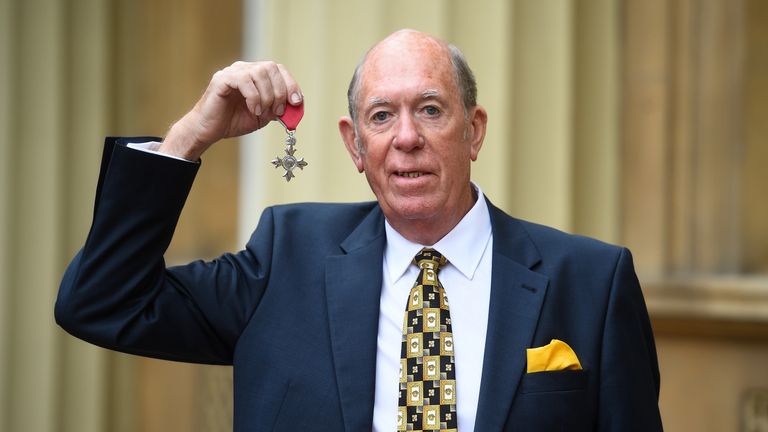 Darts player John Lowe with his MBE for services to darts and to charity after an investiture ceremony at Buckingham Palace on May 2, 2019 in London, England