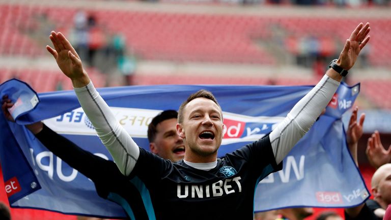 John Terry celebrates Aston Villa's promotion to the Premier League