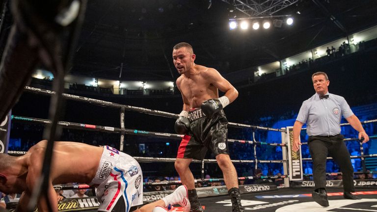 Jordan Gill is sent to the canvas by Enrique Tinoco during their featherweight showdown