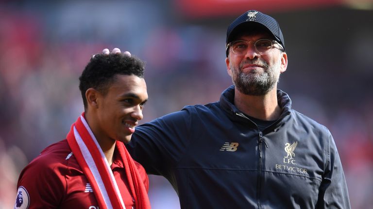 Jurgen Klopp embraces Trent Alexander-Arnold after Liverpool narrowly miss out on the Premier League title