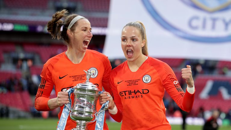 Manchester City Women goalkeeper Karen Bardsley (left) and Ellie Roebuck celebrate with the trophy…