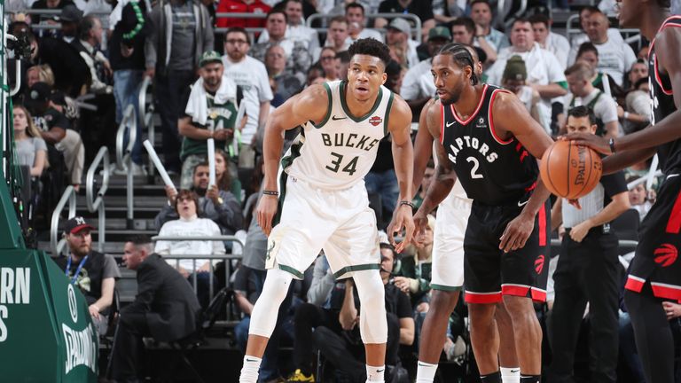Giannis Antetokounmpo #34 of the Milwaukee Bucks and Kawhi Leonard #2 of the Toronto Raptors defend their positions during Game One of the Eastern Conference Finals of the 2019 NBA Playoffs on May 15, 2019 at the Fiserv Forum Center in Milwaukee, Wisconsin