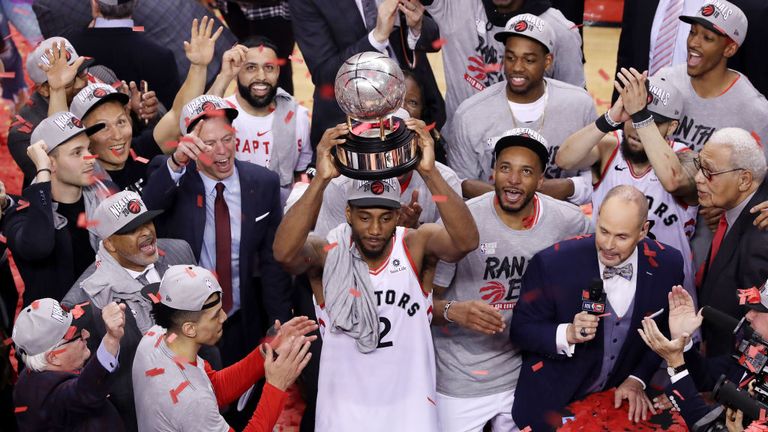 Kawhi Leonard lifts the Eastern Conference Trophy