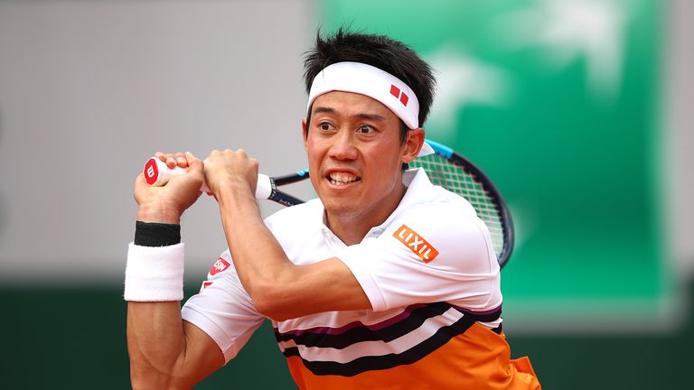 Kei Nishikori of Japan plays a backhand during his mens singles third round match against Laso Djere of Serbia during Day six of the 2019 French Open at Roland Garros on May 31, 2019 in Paris, France. 