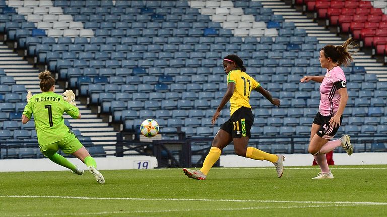 GLASGOW, SCOTLAND - MAY 28: Khadija Shaw of Jamaica scores her team's second goal early in the second half during the Women's International Friendly between Scotland and Jamaica at Hampden Park on May 28, 2019 in Glasgow, Scotland. (Photo by Mark Runnacles/Getty Images)
