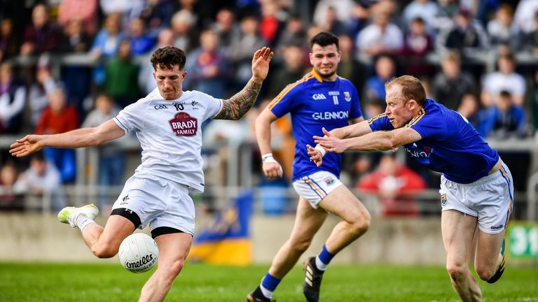 Kildare's David Slattery fires in a shot under pressure from Barry O'Farrell of Longford