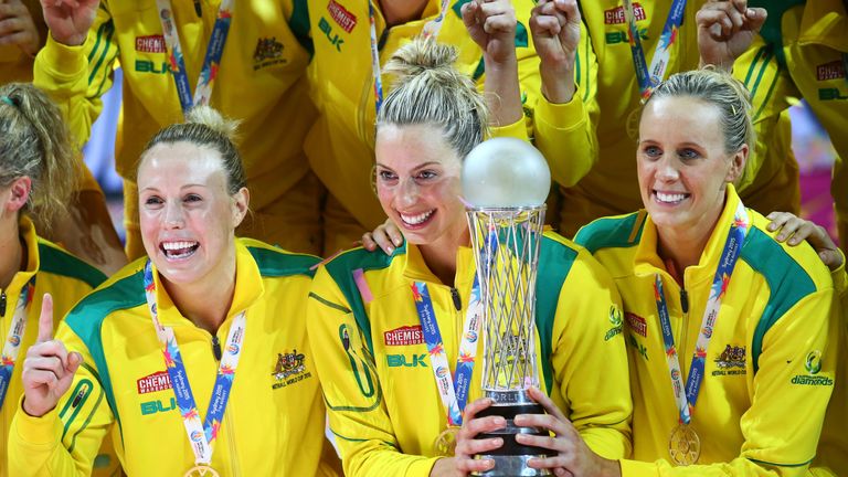 Kimberlee Green, Laura Geitz and Renae Hallinan of the Diamonds celebrate with the Netball World Cup trophy after victory in the 2015 Netball World Cup Gold Medal match