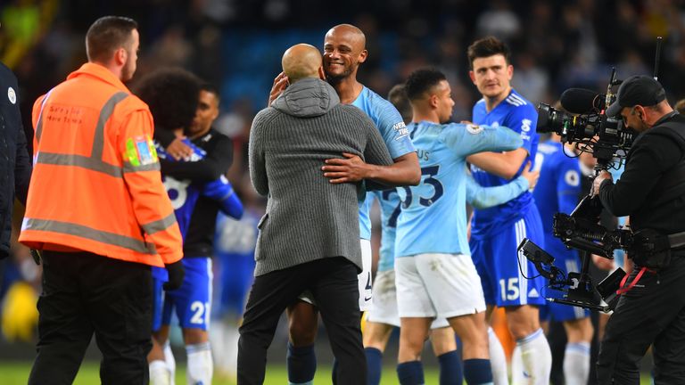 Vincent Kompany celebrates with Pep Guardiola