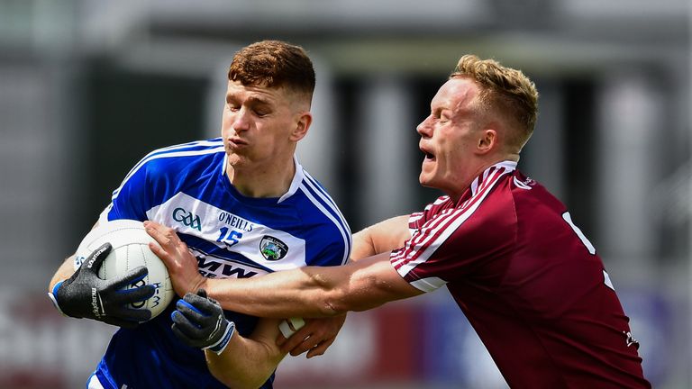 Evan O'Carroll of Laois in action against Killian Daly of Westmeath 