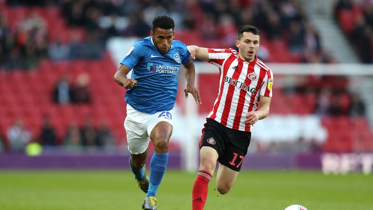 Portsmouth's Nathan Thompson (left) and Sunderland's Lewis Morgan (right) battle for the ball