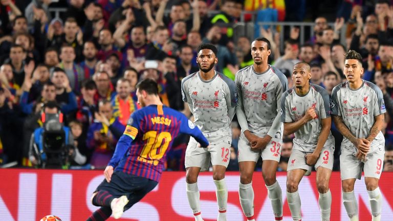 Liverpool players look on as Barcelona's Lionel Messi takes a free-kick during the Champions League semi-final at the Nou Camp