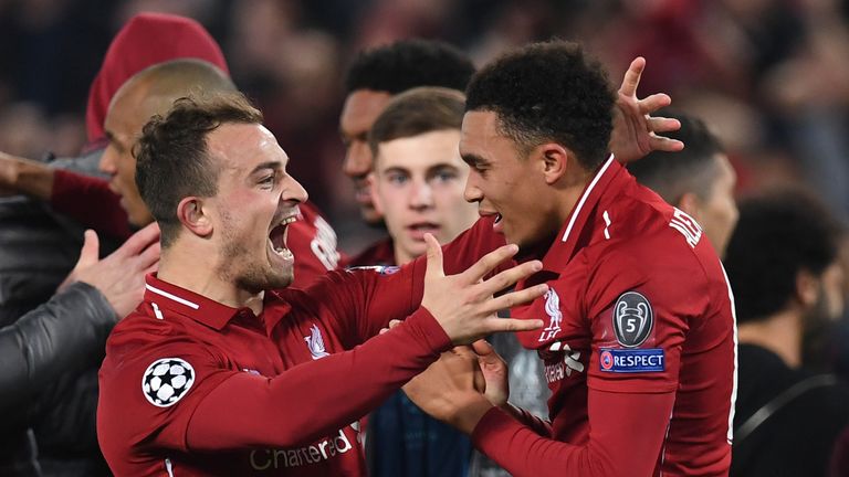 Trent Alexander-Arnold and Xherdan Shaqiri celebrate after Liverpool beat Barcelona 4-0 in the Champions League.