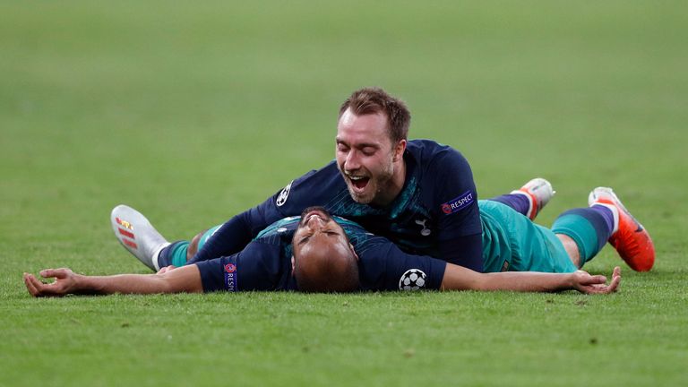 Tottenham's Brazilian forward Lucas celebrates after scoring a goal with teammate Tottenham's Danish midfielder Christian Eriksen (up) during the UEFA Champions League semi-final second leg football match between Ajax Amsterdam and Tottenham Hotspur at the Johan Cruyff Arena, in Amsterdam, on May 8, 2019. (Photo by Adrian DENNIS / AFP) (Photo credit should read ADRIAN DENNIS/AFP/Getty Images)
