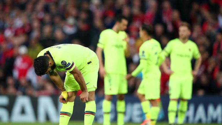 Luis Suarez shows his dejection at Anfield