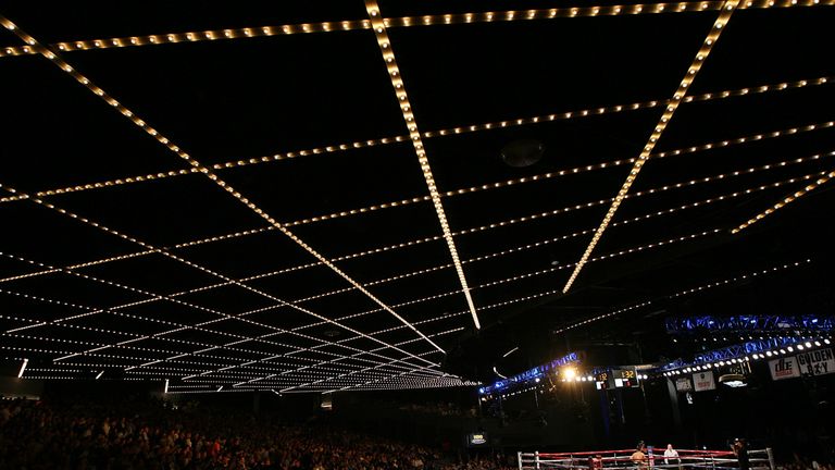 Amir Khan (L) of Great Britain hits Paulie Malignaggi during the WBA light welterweight title fight at Madison Square Garden on May 15, 2010 in New York City.
